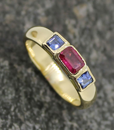 sapphire and ruby rub over set band gold ring