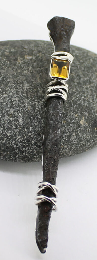 nail and citrine kilt pin